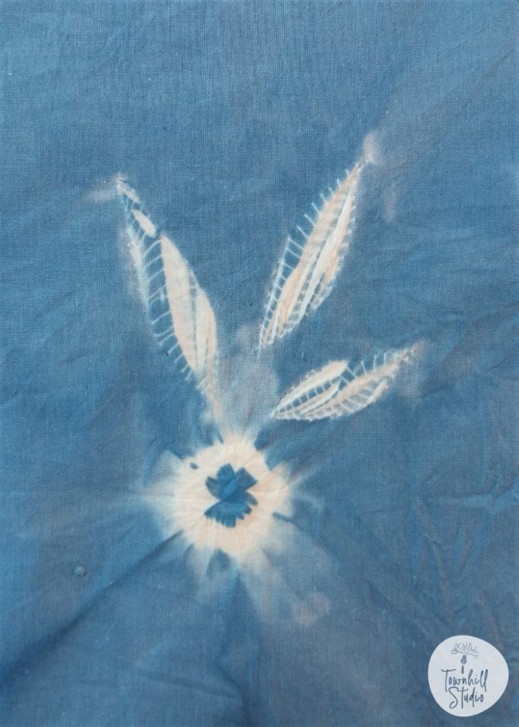 4 Designs to Discover and Learn in Guntai Stitched Shibori 10 indigo dyed guntai shibori pattern with a ne-maki bead added