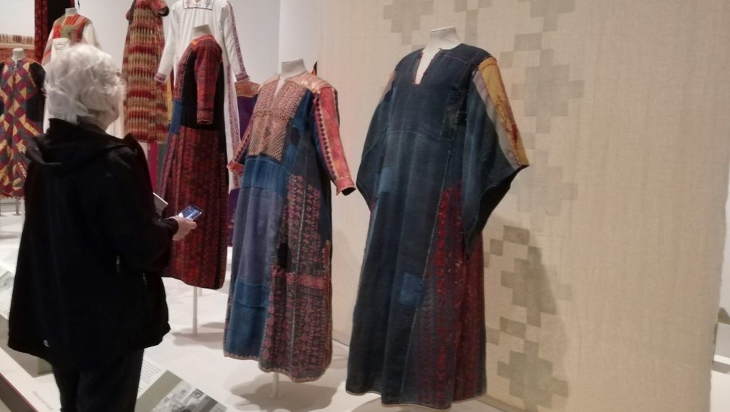 Stitching Stories: A Captivating Palestinian Embroidery Exhibition 1 A display of Palestinian dresses at the exhibition