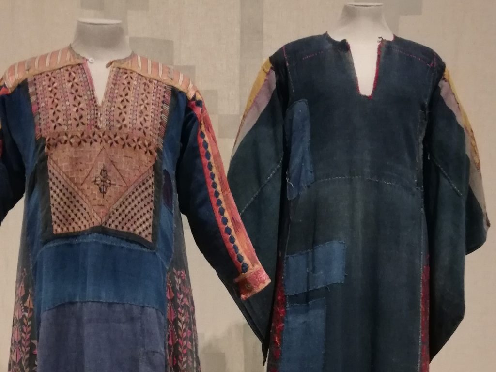 Stitching Stories: A Captivating Palestinian Embroidery Exhibition 1 Two embroidered Palestinian dresses