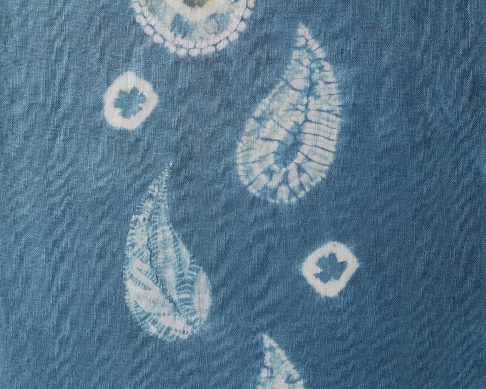 white paisley resist designs on blue
