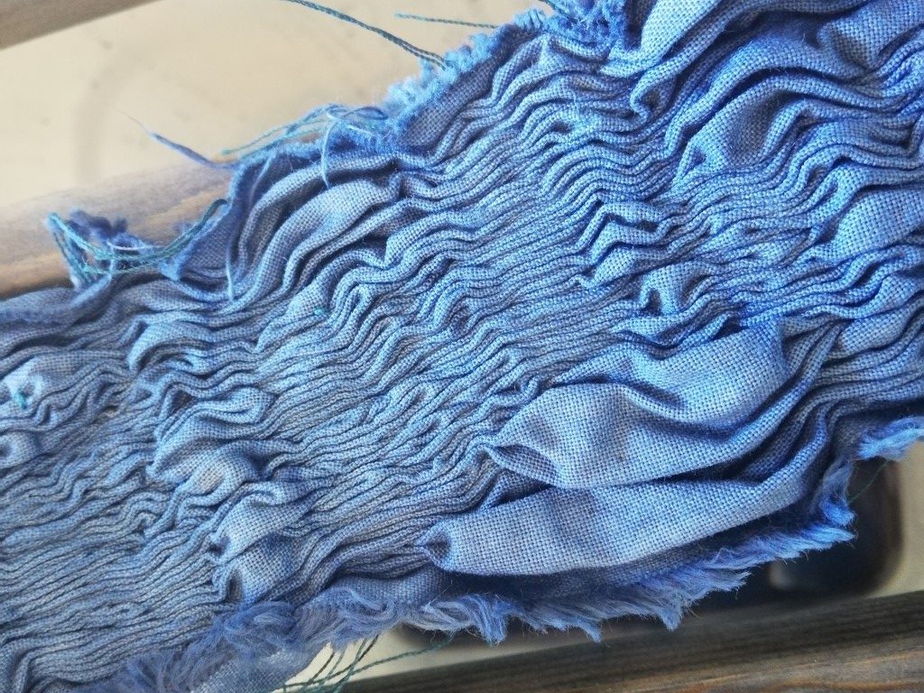 Mokume stitch, fabric gathered before unpicking