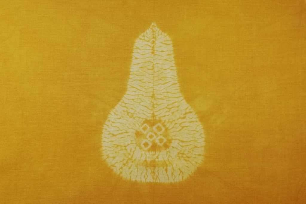 Tie-Dye on Your Plate: Create Some Shibori Vegetables 7 a shibori vegetable, a golden squash with seeds inside. White design on gold dyed fabric.