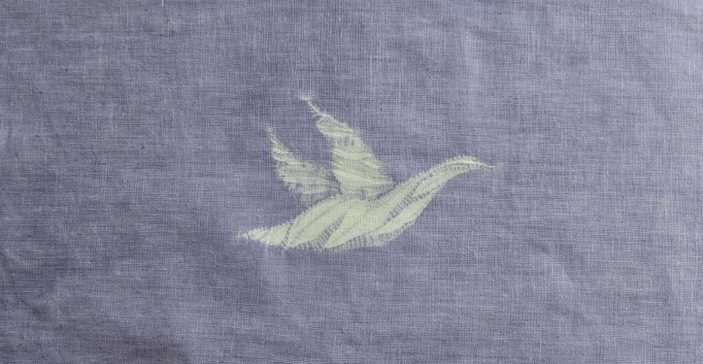Make a Super shibori goose in guntai shibori 1 A shibori goose flying across a soft mauve sky