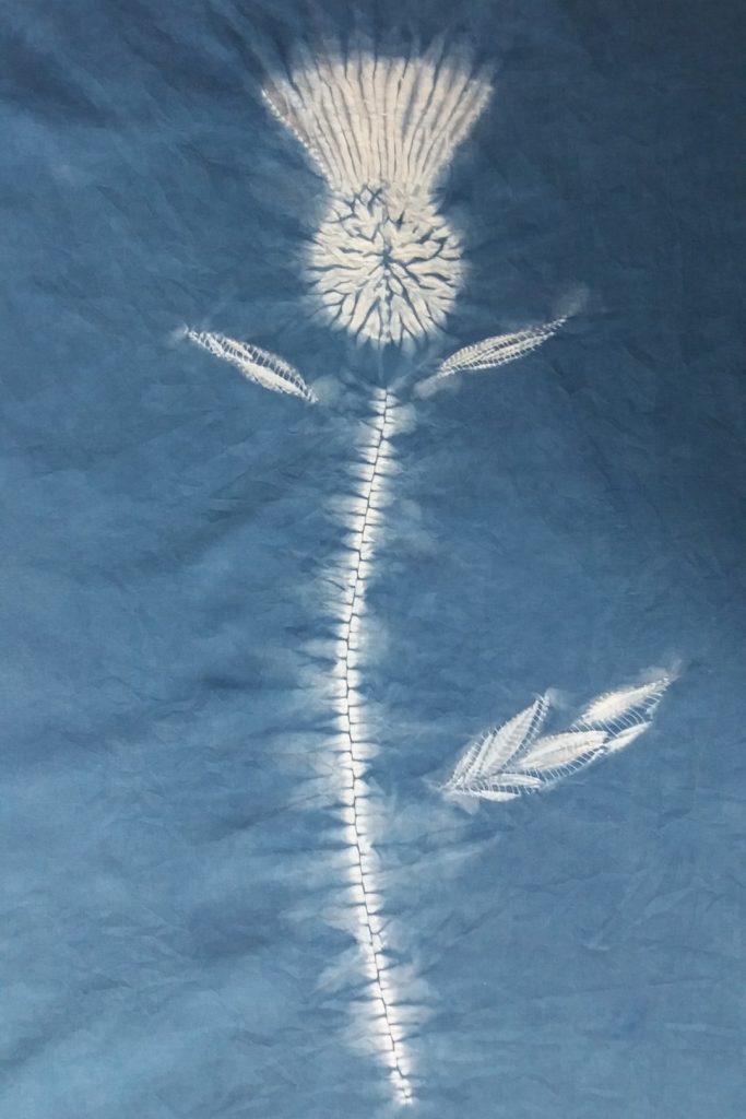 How to Shibori with Natural Dyes 1 a white shibori design on blue dyed fabric
